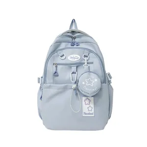 Sac à dos d'école bleu clair pour filles avec motifs d'étoiles et mini pochette assortie