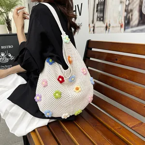 Minimalist white crochet tote bag with colorful 3D floral accents for women's street style