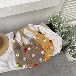 Floral crochet tote bag in brown, yellow and white with 3D colorful knit flower patterns