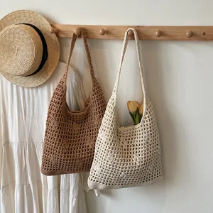 Chic hollow out crochet beach tote bag in brown and cream for summer vacation style