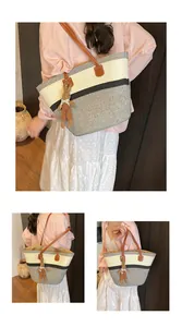 Three-color woven tote bag with leather straps and cute rabbit charm detail