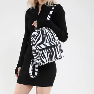 Large zebra print backpack for women with metal zipper and front pocket in classic style