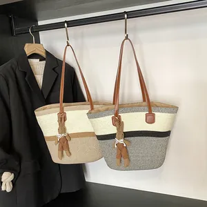 Large woven tote bag with shoulder straps and cute bunny charms in two colors