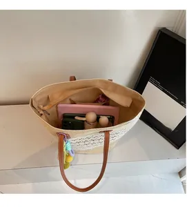 Detailed view of the large capacity woven tote bag interior with daily essentials