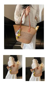 Detail of hand-woven straw tote with hollow lattice patterns and colorful ball pendants