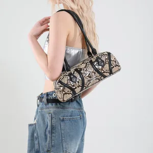 Fashionable snakeskin cylinder shoulder bag with black leather trim and silver metal rivets