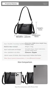 Detailed view of the black leather crossbody bag showing dimensions 22cm x 15cm x 10cm