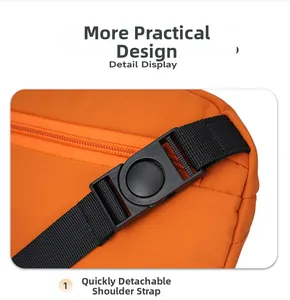 Detail of orange nylon bag featuring quick-release black plastic buckle and strap