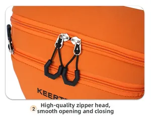 Close-up of orange nylon bag with durable dual zippers and easy-pull cord handles