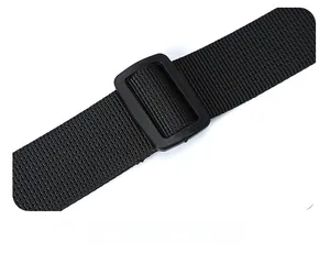 Detail of adjustable black nylon shoulder strap with plastic buckle for crossbody bag