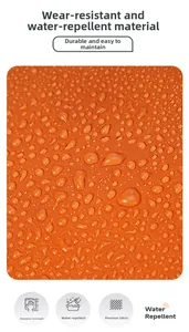 Close-up of orange waterproof nylon fabric with water droplets showing splash resistance