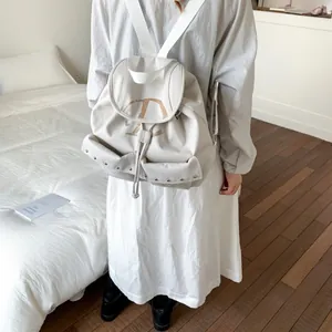 Off-white nylon backpack for women with silver rivets and flap drawstring closure
