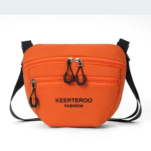 Detail showing bright orange nylon bag with triple zippers and black hexagonal ring pulls