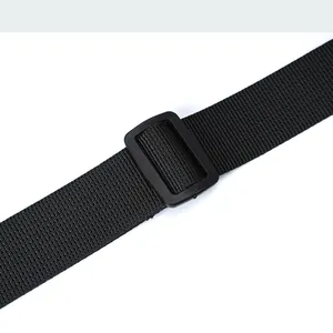 Detailed macro view of the black nylon shoulder strap with a durable plastic slide buckle