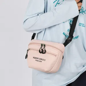 Versatile light pink nylon crossbody bag with multi-layer zippers and adjustable strap