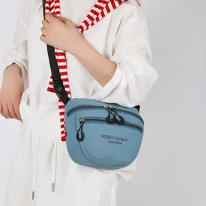 Versatile blue nylon crossbody bag with dual zipper compartments and adjustable strap