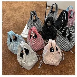 Close-up of luxury rhinestone bucket bags in multiple colors with silver chain straps
