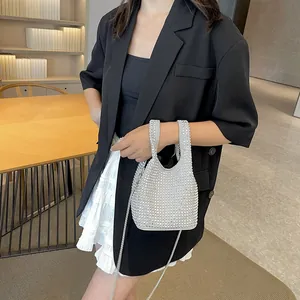 French vintage silver rhinestone bucket bag with shiny handle and crossbody metal chain strap