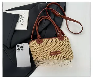 Detail showing woven bucket bag size comparison with smartphone and stylish knot handle