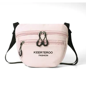 Sac bandoulière polyvalent en nylon rose clair avec double fermeture éclair