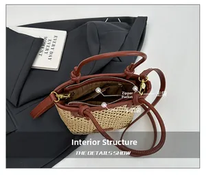Interior view of straw tote bag showing striped lining with main and zipper pockets
