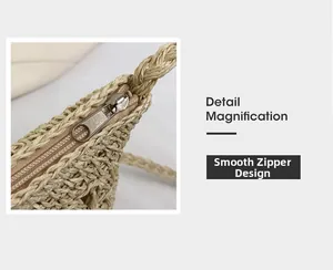 Detail magnification showing the smooth silver zipper and woven texture of the straw bag