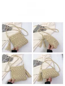 Detail view of handmade straw crossbody bag with hollow crochet patterns and long tassels