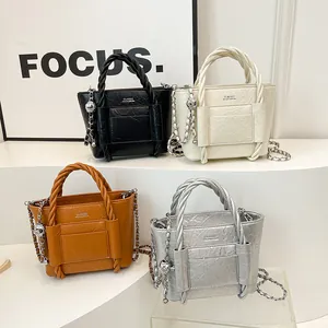 Minimalist textured PU leather bucket bags with woven handles and chain straps in four colors