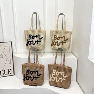 Chic woven straw tote bags with Bon jour embroidery in four versatile colors