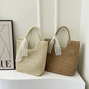 Handmade woven straw tote bags with lace ribbon in cream and brown, beach style