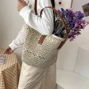 Large capacity straw woven tote bag for summer beach vacation with brown leather straps