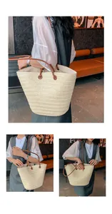 Vue détaillée du grand sac cabas en paille avec des anses en cuir marron pour femmes