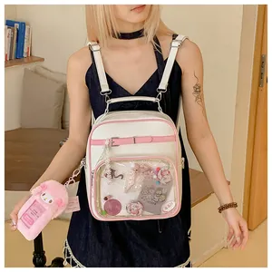 Detail of white and pink faux leather Ita bag featuring large transparent window for badges