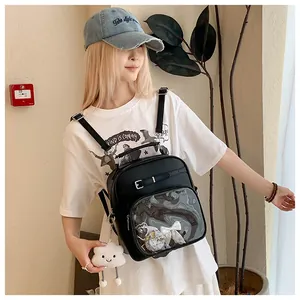Side view of black Ita bag with transparent PVC window and plush cloud keychain on model