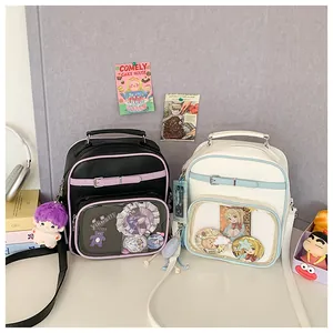 Detail view of two Ita bags with clear PVC windows for displaying anime badges and charms