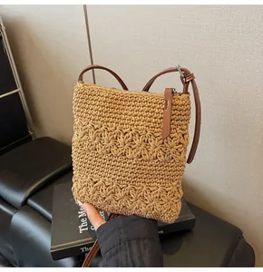 Detail of hand-woven floral hollow pattern on a beige tote bag with a zipper closure
