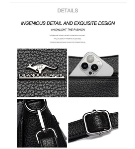 Detailansicht der schwarzen Handtasche aus Leder mit Känguru-Logo und silbernen Beschlägen