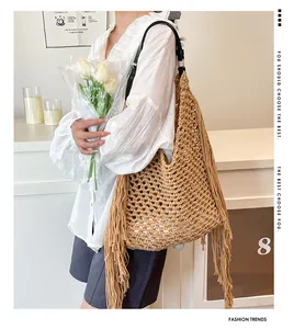 Detailed view of handmade hollow crochet weave and long tassels on khaki tote bag