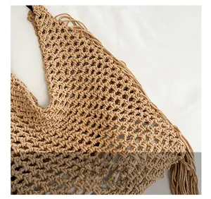 Detail showing handcrafted crochet weave and fringe edge of the khaki beach tote bag