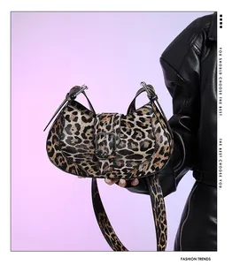 Detail view of leopard print shoulder bag with vintage metal buckle and textured leather finish