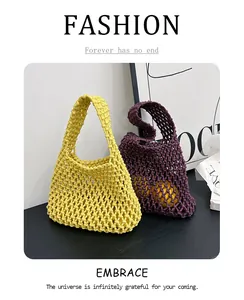 Detail of handmade crochet handbag showing hollow knit pattern in yellow and purple