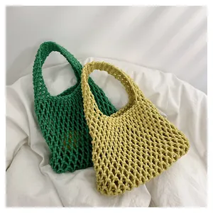 Detailed view of handmade hollow woven cotton rope handbag with summer net mesh design
