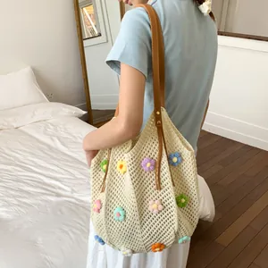 Fashionable hand-woven crochet tote bag with colorful 3D flowers and brown leather handles