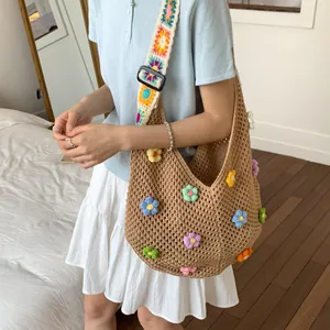 Handmade crochet tote bag with 3D colorful flowers and patterned shoulder strap