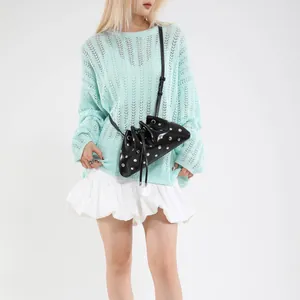Chic black drawstring bucket bag with silver metal rivets and thin shoulder strap