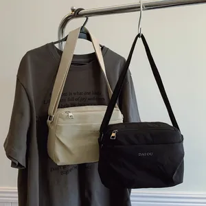 Minimalist nylon waterproof crossbody bags in beige and black with adjustable straps