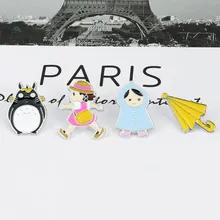 Pins en émail détaillés avec personnages de dessins animés et parapluie sur carte Paris