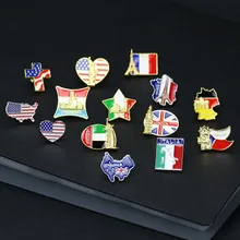 Collection of world flag and landmark enamel pins on black textured background