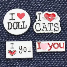 Enamel pins set with hearts and I Love text on a denim jacket background