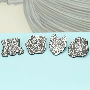 Detailed view of geometric black and white enamel animal lapel pins featuring lion and wolf